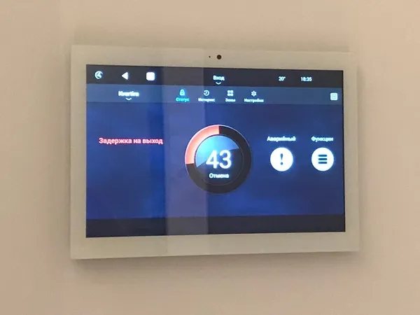 Home security panel with camera and alarm status